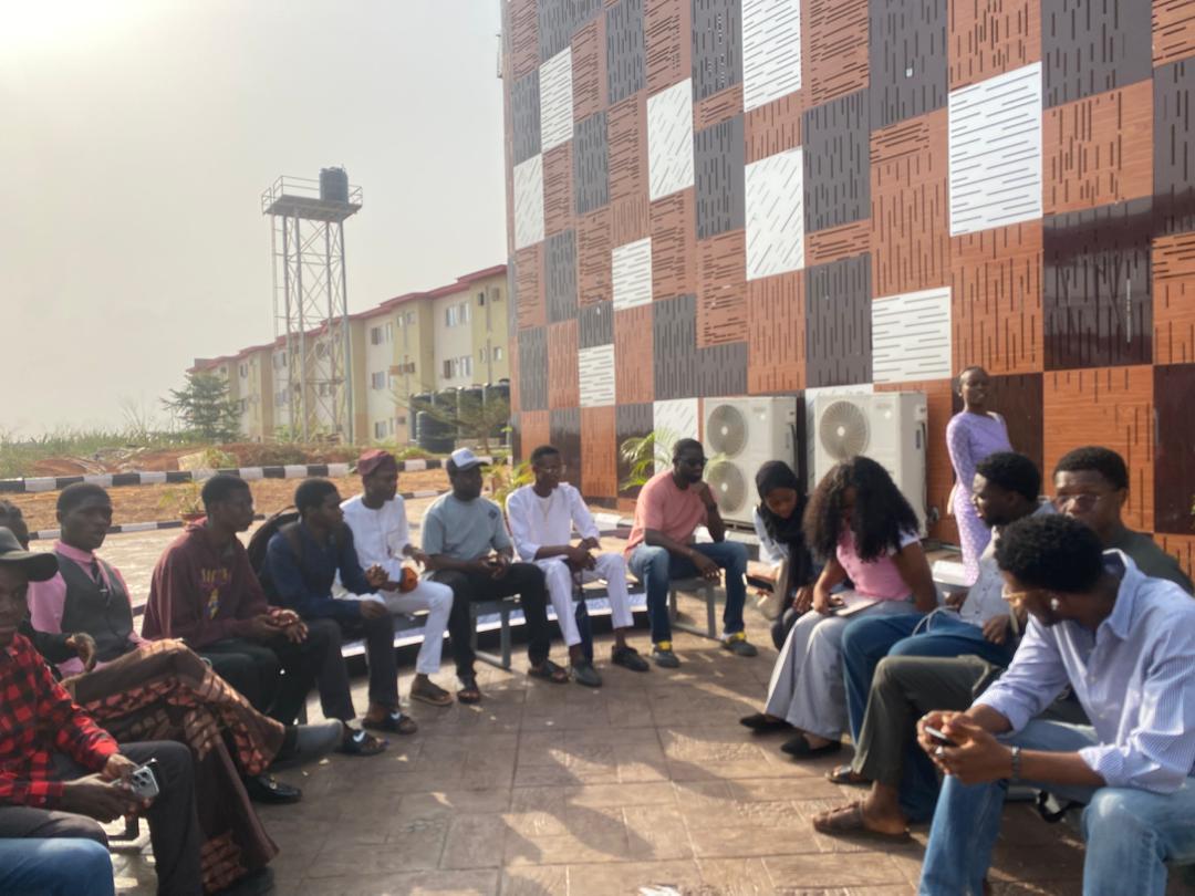 Student interaction in the hall.