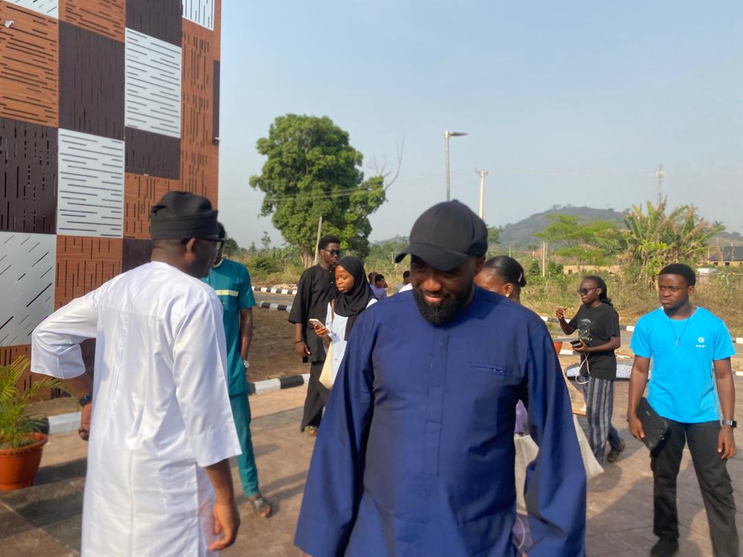 Dignitaries speaking to students.